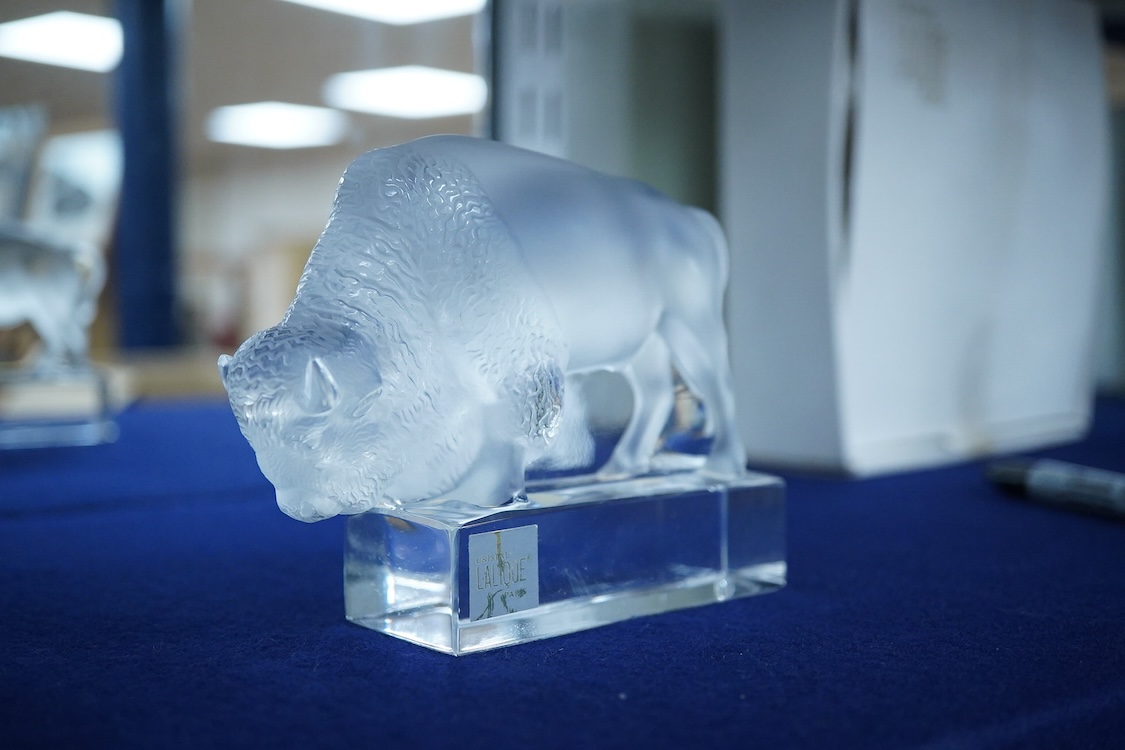 A Lalique crystal frosted glass Bison on polished clear glass paperweight paperweight (boxed), 12cm wide x 10cm high